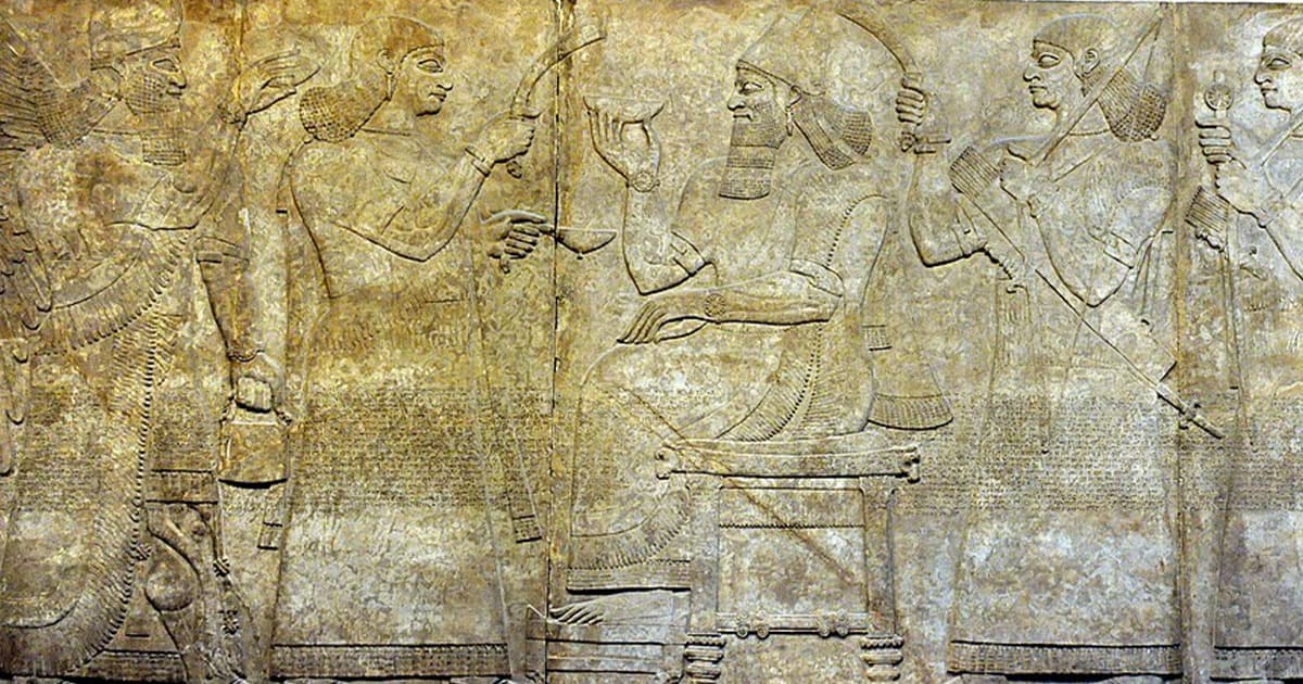 Bird-headed Apkallu relief from Nimrud holding a bucket and cone