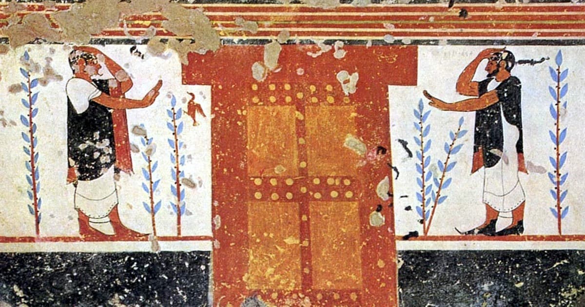 Etruscan tomb chamber with sarcophagus and grave goods.